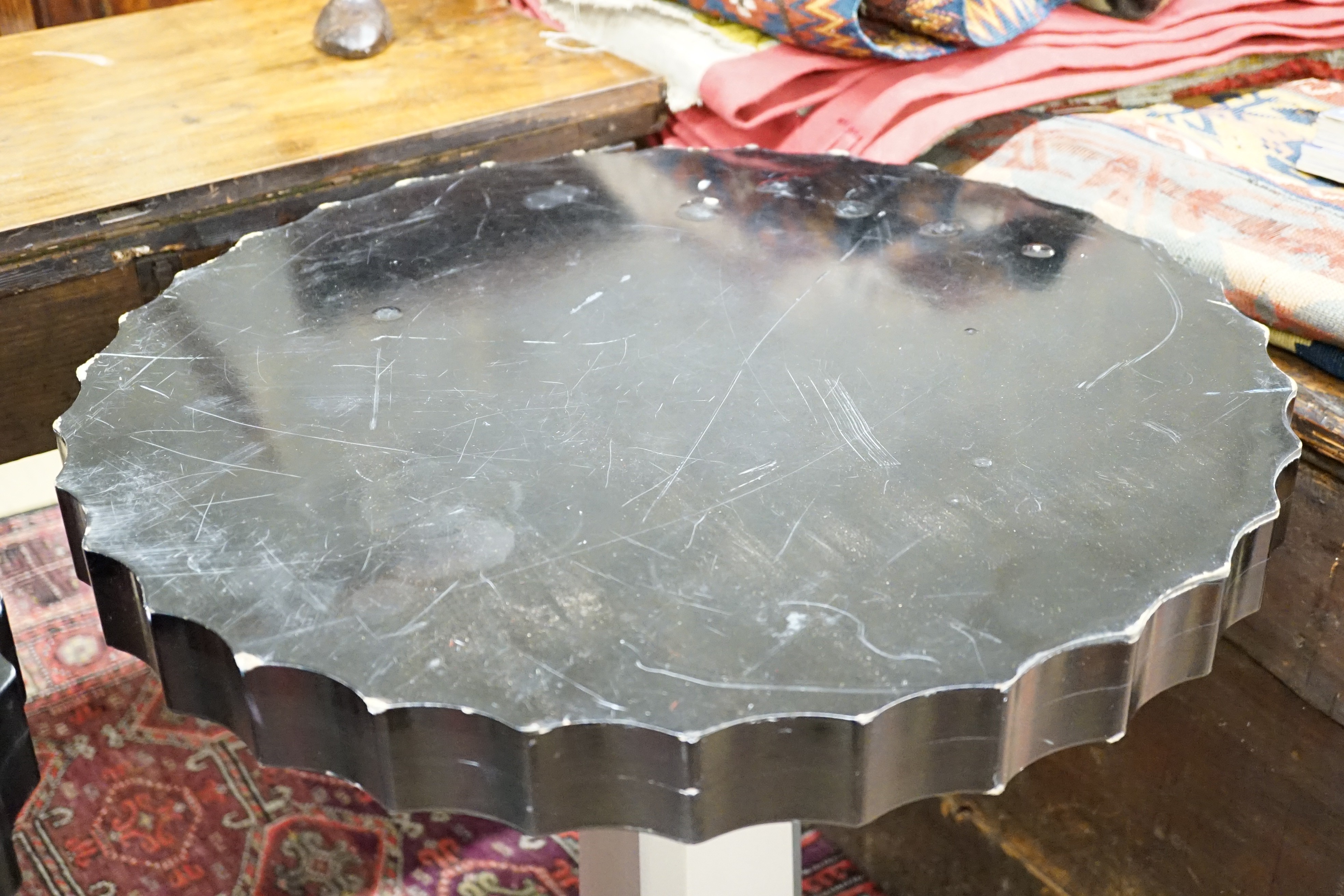 A pair of Art Deco ebonised and silvered wood occasional tables, diameter 60cm, height 71cm
